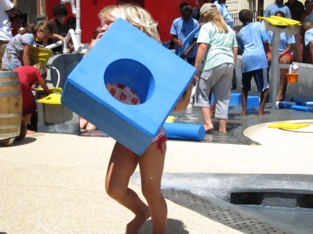 Danielle Andrews, 2, carried a block that was almost as big as she is.