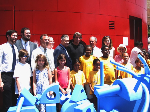Architect David Rockwell, Mayor Michael Bloomberg, Assembly Speaker Sheldon Silver and other local political leaders stand behind the playground's signature blue foam blocks.