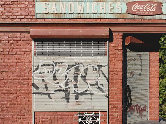 A 1/12th scale model of a storefront at the corner of Marcy Street and Hope Avenue in Williamsburg, Brooklyn.