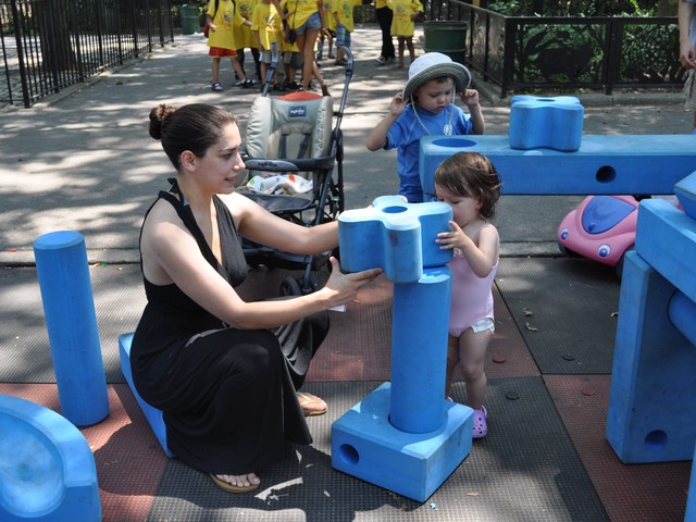 Tanya Barack and daughter Sofia, 19 months old, play with the blocks.