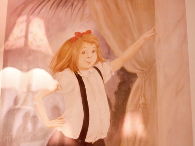 A portrait of Eloise stands inside the bathroom of the suite.