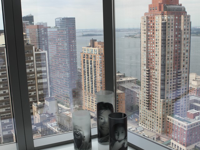 A sweeping view appears behind three candles from the 2009 UNICEF Snowflake Ball, which annually takes place in Manhattan.