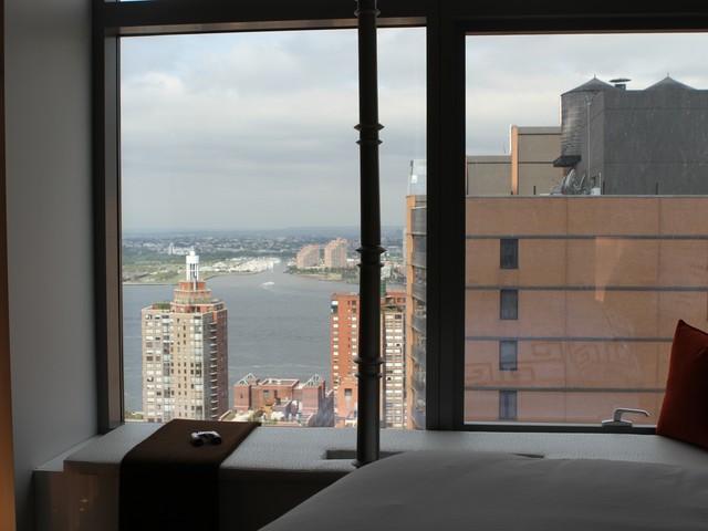 Both the bedroom and the living room have vast views of downtown Manhattan.