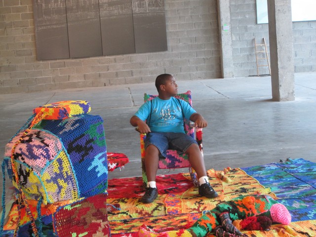 Paul Gaston, 11, sits in one of the interactive exhibits.