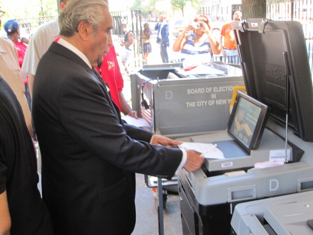 Rep. Charles Rangel gets a demonstration of how to use the new voting machines.