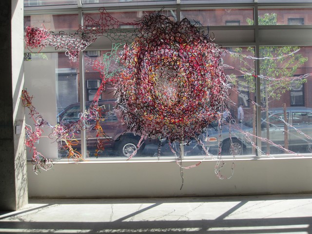 An exhibit by artist Blanka Amezkua is made of entwined pipe cleaners and encourages visitors to touch.
