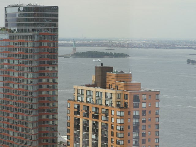 The new 900-square apartment living room overlooks the Statue of Liberty.