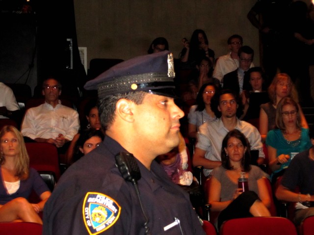 Police officers attended Tuesday's meeting, which was mostly quiet and orderly.
