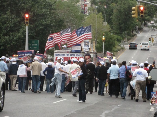 The large Espaillat-Linares group marches north on Broadway.