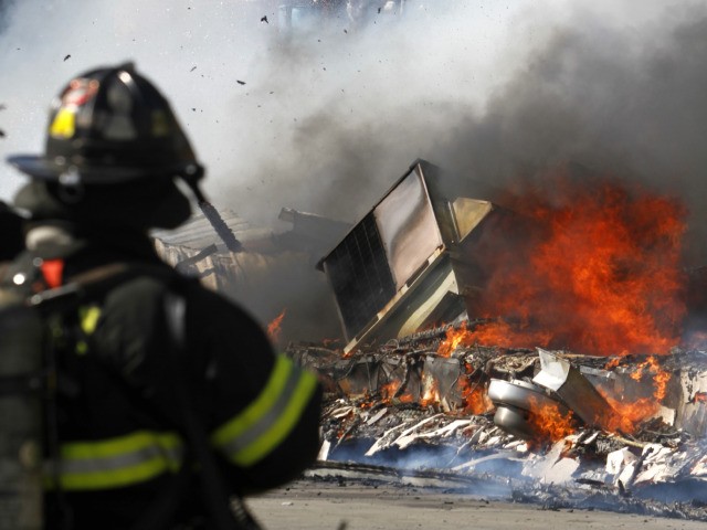 Firefighters battle a blaze at a Sanitation facility on a Hudson River pier.