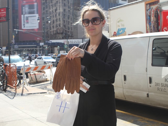 Graduate student Jen Jenicka, 26, shows off her new Hermes purchase from Wednesday's sample sale.
