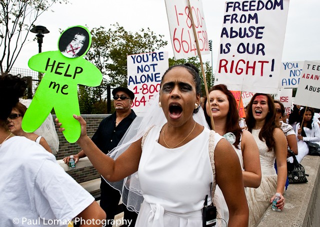 Hundreds of people marched in the 10th annual Brides March Against Domestic Violence on Sunday.