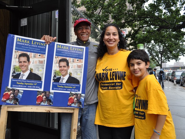 Councilmember Robert Jackson joins Levine's wife Ivelisse Suarez.