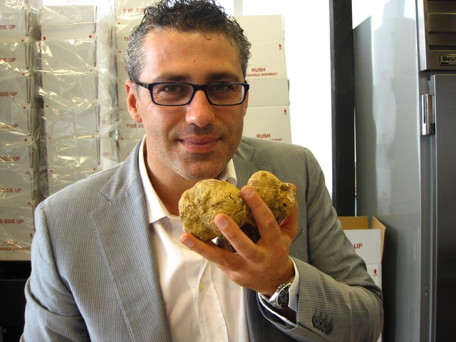 Urbani Truffles vice president Vittorio Giordano inhales the heady scent of truffles, which he says he 