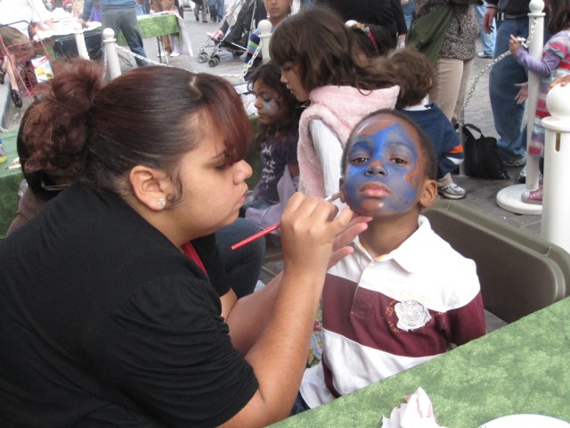 Nekia Bland, 5, a Brooklyn resident, got his face painted like a globe.
