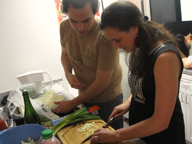 Felipe Donnelly offers his wife and sous chef Tamy Rofe some advice on scallion chopping.