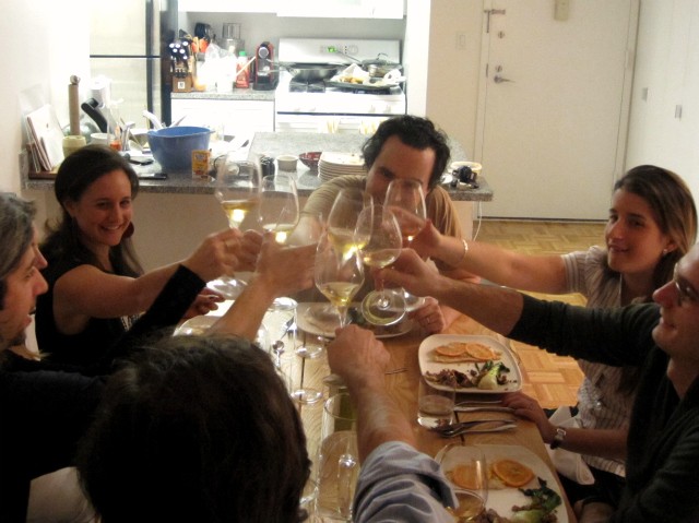 A toast to the founders of Worth Kitchen, who started the weekly dinner party in their apartment last spring.