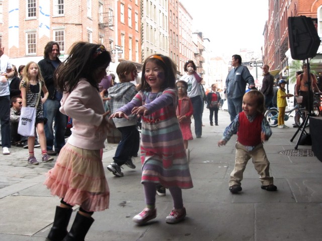 Children danced in front of the stage on Front Street while the band Supercute! played.