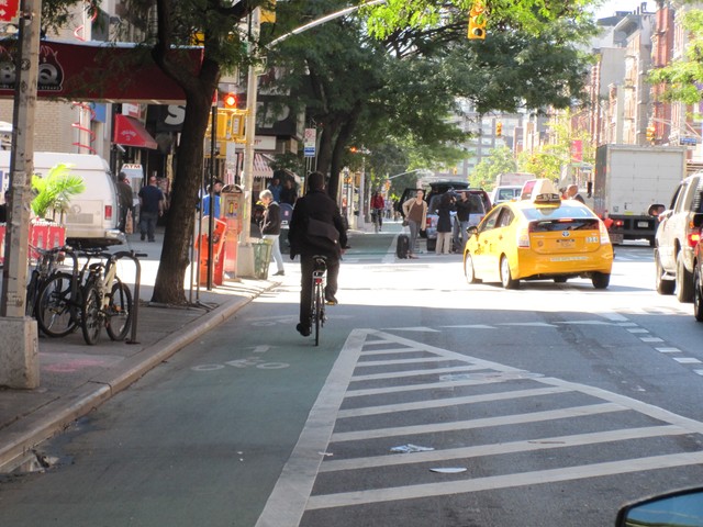 A cyclist uses a bike lane on Second Ave. in the East Village.
