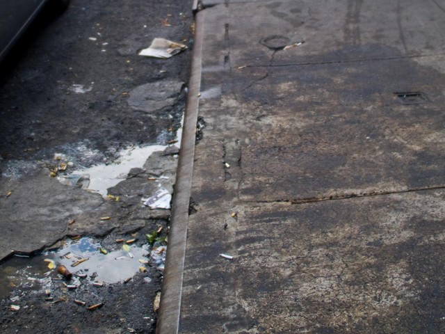 A filth-covered Baxter Street in Chinatown.