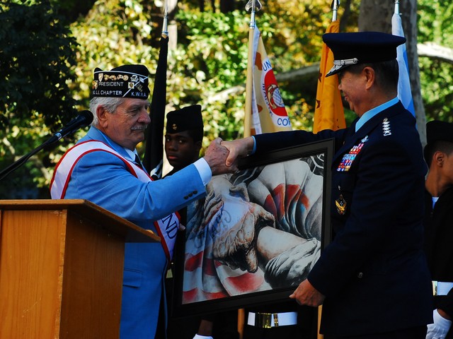 Sal Scarlato of the Korean War Veterans Association presents a Korean General with a symbol of the bond between Korea and the US.