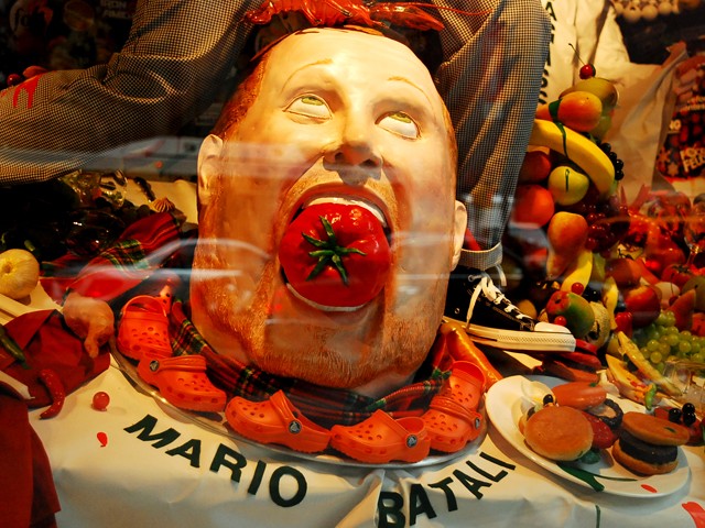 A stuffed Mario Batali and a garnish of Croc shoes in The Food Network themes windows at Barneys.