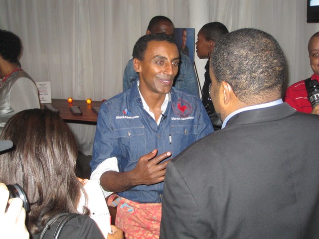 Samuelsson works the crowd at his Red Rooster Harlem restaurant.