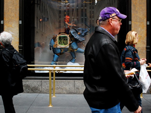 A high fashion tale of wonder at Saks Fifth Avenue. Several designers created one-of-a-kind pieces for the window.