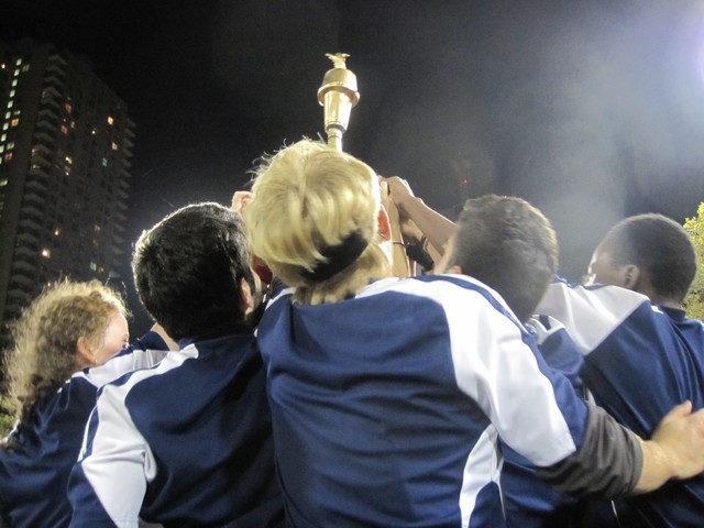 Members of the victorious Middlebury squad gathered around their trophy.