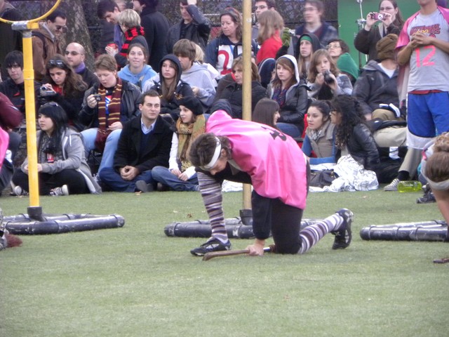 Opposing teams kneel at their respective goals before game play begins.