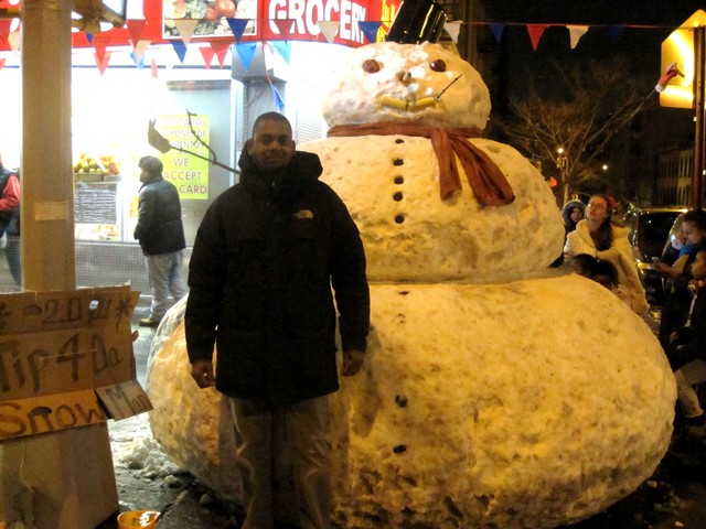 Jackman Suarez builds a snowman on the corner of 169th Street and Audubon Avenue every year.