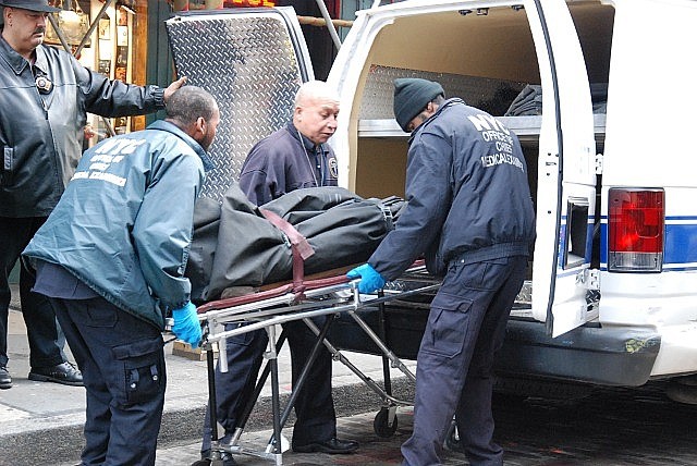 Mark Madoff's body is removed from his Mercer Street apartment.