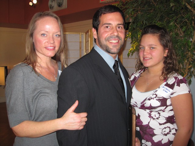 13th Precinct honoree Officer Leonardo Nimo, with his wife Johanna and daughter Michaela.
