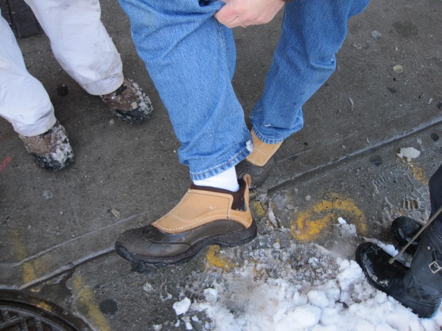 Jerry Feldman shows off the boots that brought him through the slush.