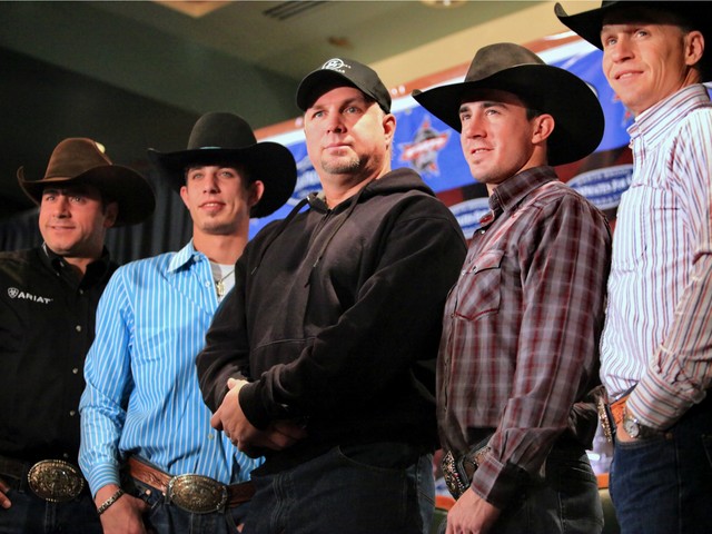 Country Music recording artist and philanthropist Garth Brooks, center, pose with bull riding stars Adriano Moraes, far left, three-time Professional Bull Riders (PBR) world champion, J.B. Mauney, second from left, Kody Lostroh, second from right, PBR 2009 world champion, and Ty Murray, far right, PBR co-founder, during a news conference in New York, Friday Jan. 8, 2010.
