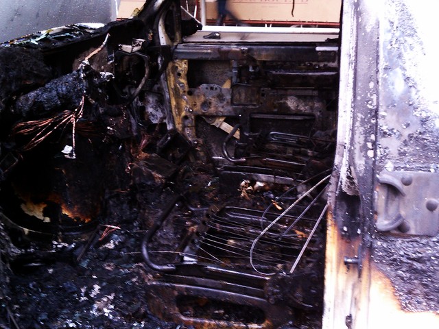 The front seats of the van were completely destroyed and the steering wheel was melted by the flames.
