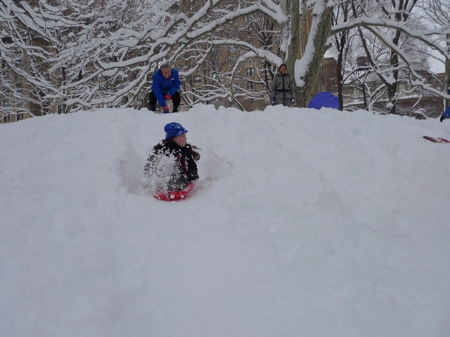 Anna Rogoff coasts down a Central Park hill after a push from her grandfather.