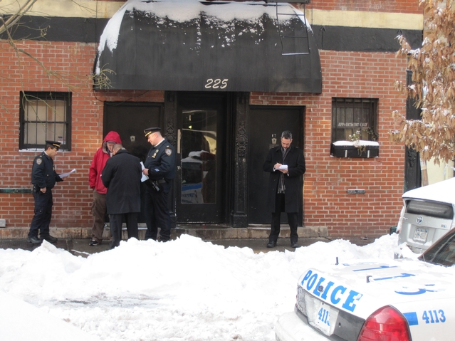 Police outside 225 E. 2nd St., where a man was shot Wednesday morning.