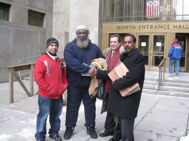 Chess players Chris Peralta (from left) and Yacahudah Harrison celebrated with their attorneys Norman Seigel and Earl Ward after a judge dismissed the case against them.