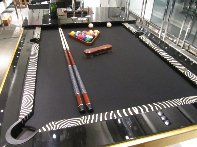 Pool table/dining table with gold leaf ($49,000) at the OC Concept Store. Custom variations start at $10,000.