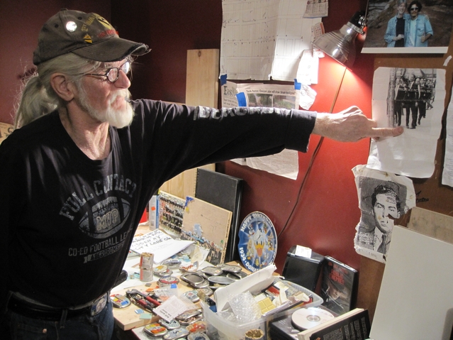 Powers points to a picture of President Obama next to one of his light poles.