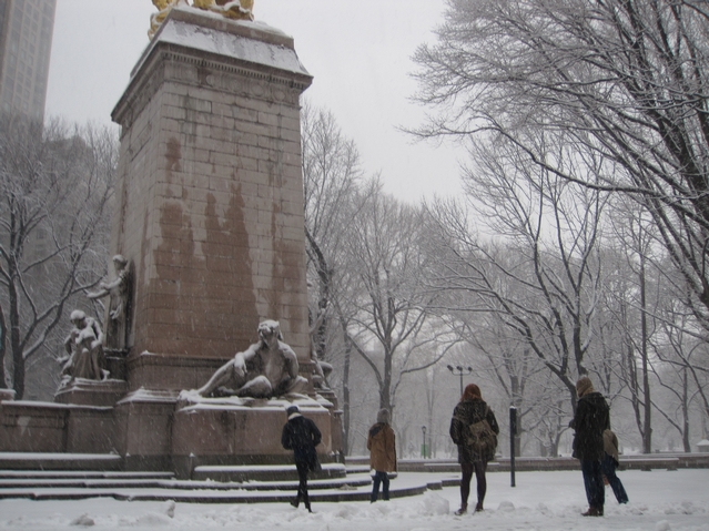 The Bugler family from London, England held a snowball fight in Columbus Circle during Monday's snowstorm.