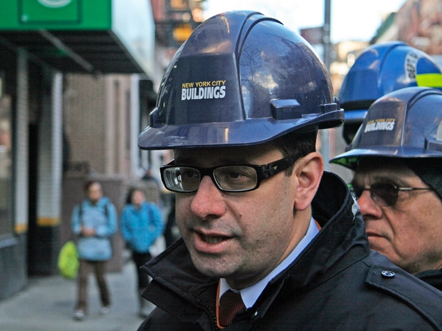 Department of Buildings spokesperson Robert LiMandri speaks across the street from the construction site.