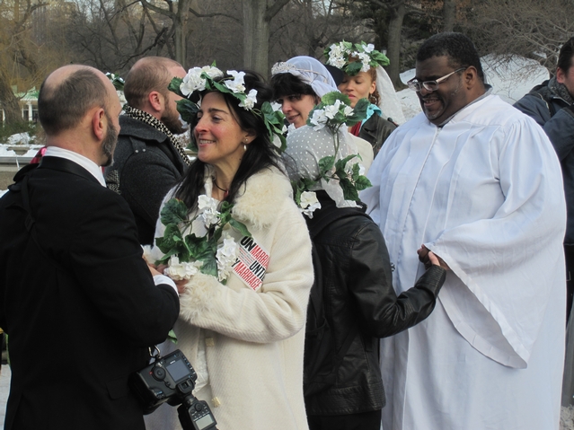 About a dozen couples braved the cold Sunday to un-exchange wedding vows at the Bethesda Fountain in Central Park until all couples, including LGBT partners, can marry under the law.