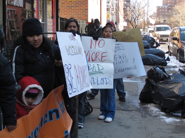Residents protest living conditions outside of their building at 21 E. 115th St.