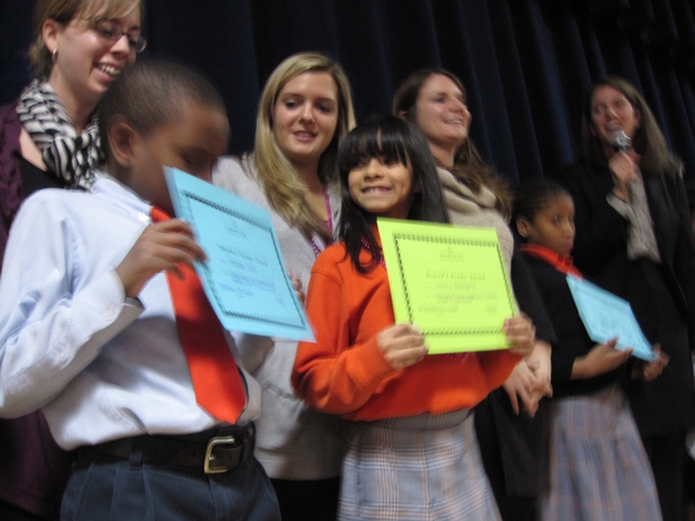 Harlem Success kids with their reading certificates.
