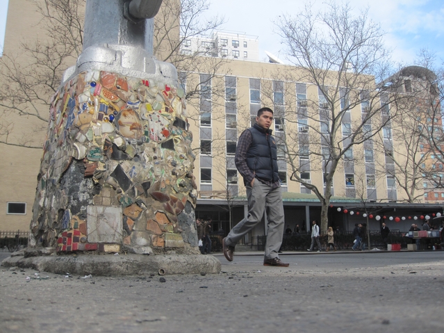 Powers points to a picture of President Obama next to one of his light poles.