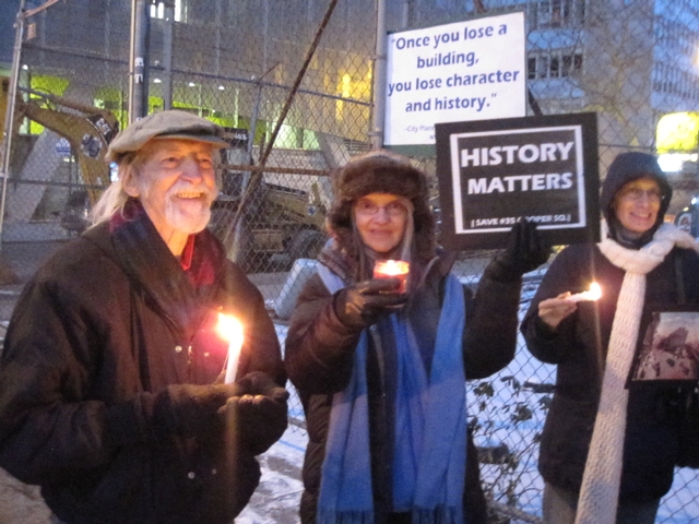 Demonstrators gathered for a candlelight vigil in front of 35 Cooper Square.