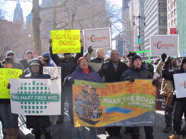 Protesters marched from City Hall to the hearing, waving signs and chanting.