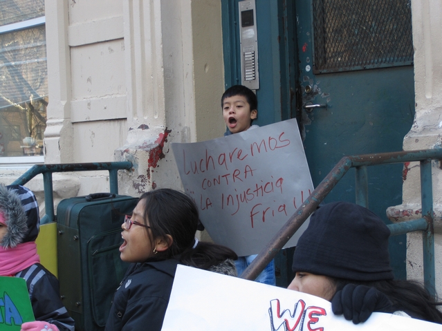 Residents protest living conditions outside of their building at 21 E. 115th St.